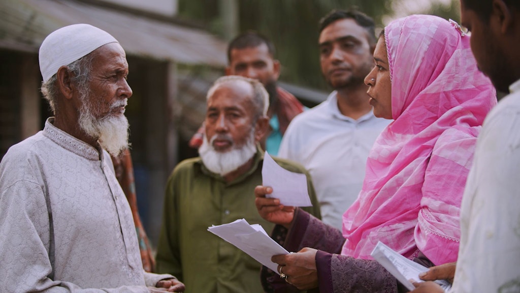 A politician speaks to a voter during an election campaign.