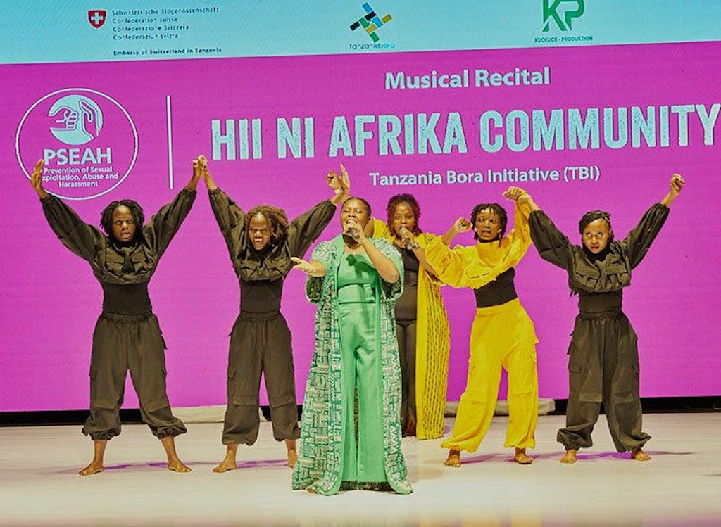 Performers on stage performing the opening song which was specially written for the PSEAH Forum Theatre Event in Dar es Salaam, Tanzania.
