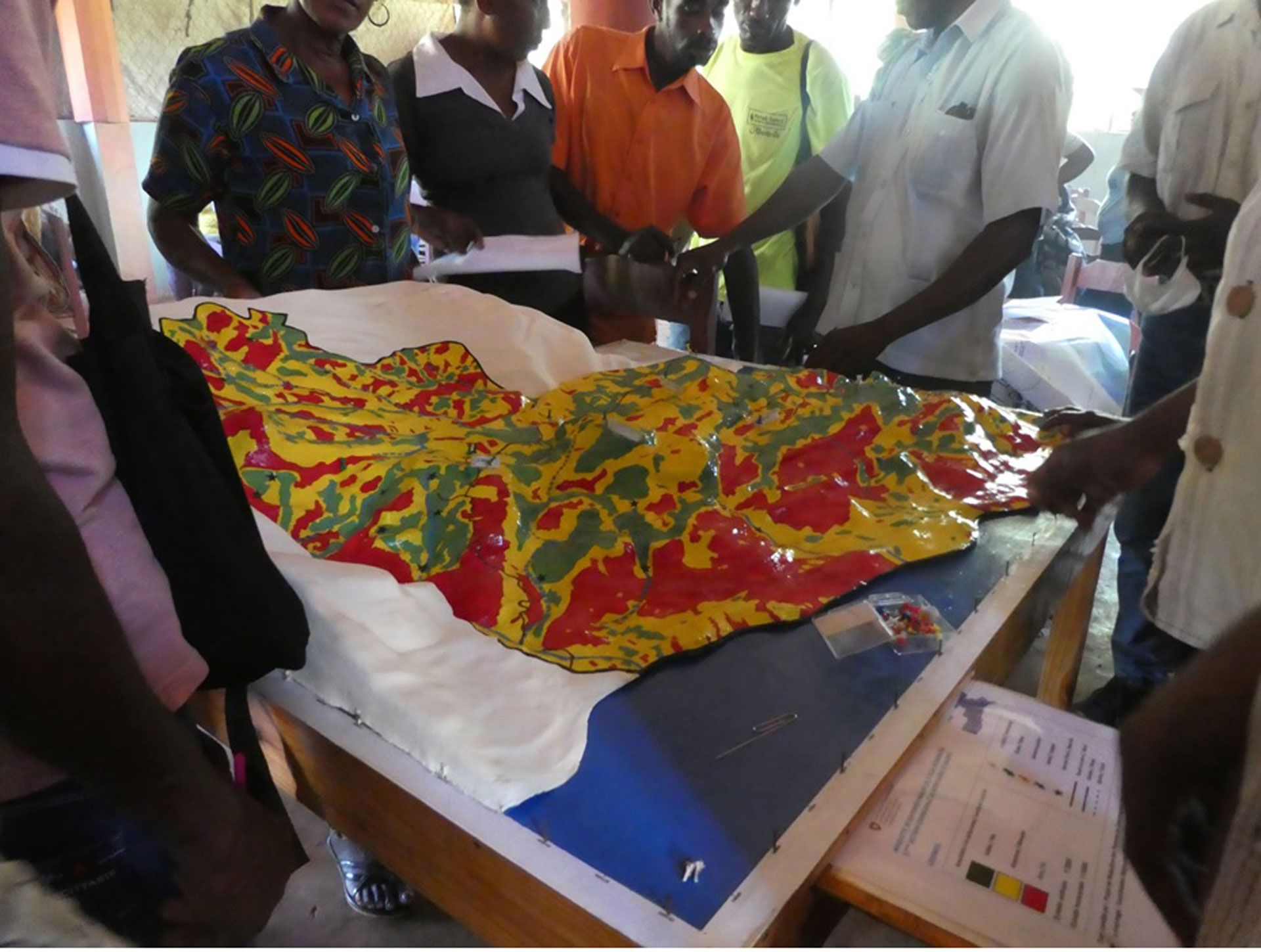Photo of a 3D model of a hill, with color variations to reflect the risk of hazards.