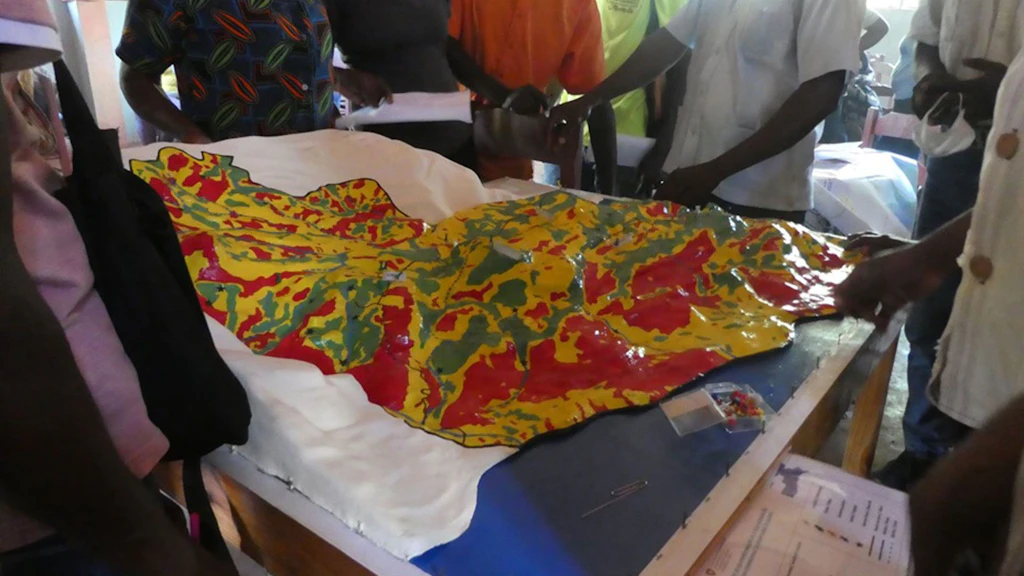 Photo of a 3D model of a hill, with color variations to reflect the risk of hazards.