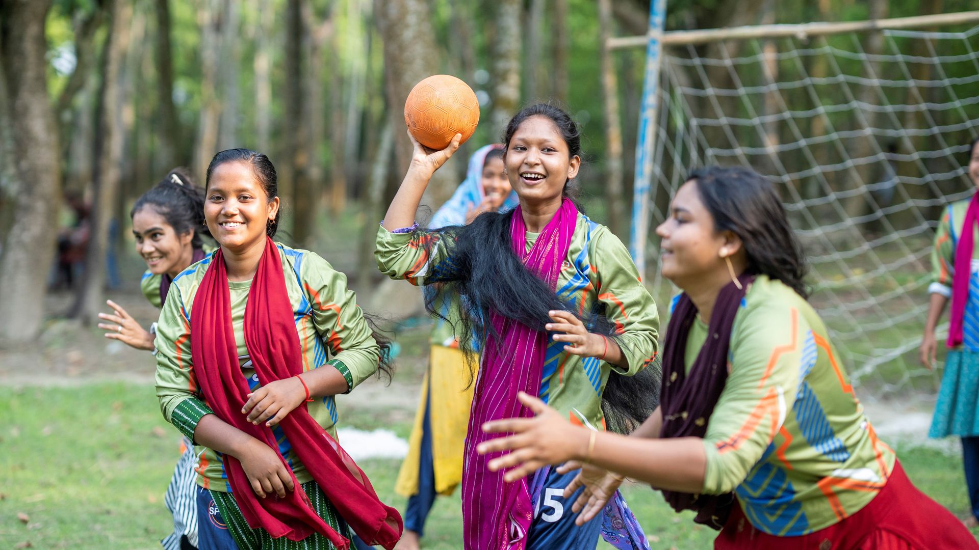 Girls participating in handball.