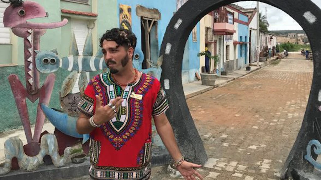 A Cuban LGBT activist stands on the street.