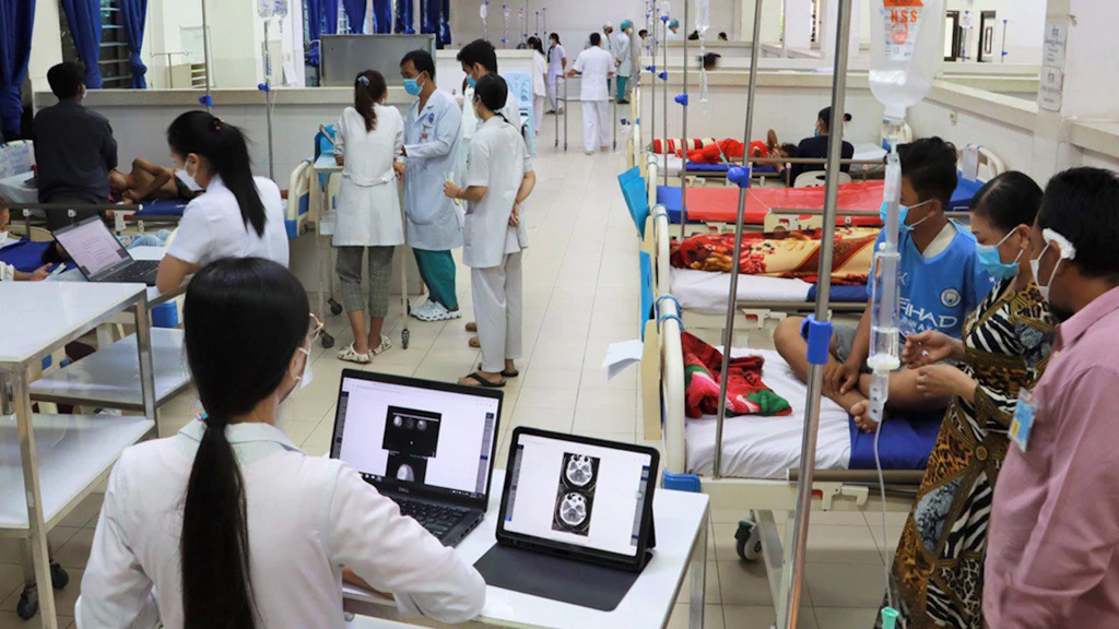  A ward in a Kantha Bopha children's hospital filled with patients and carers. 
